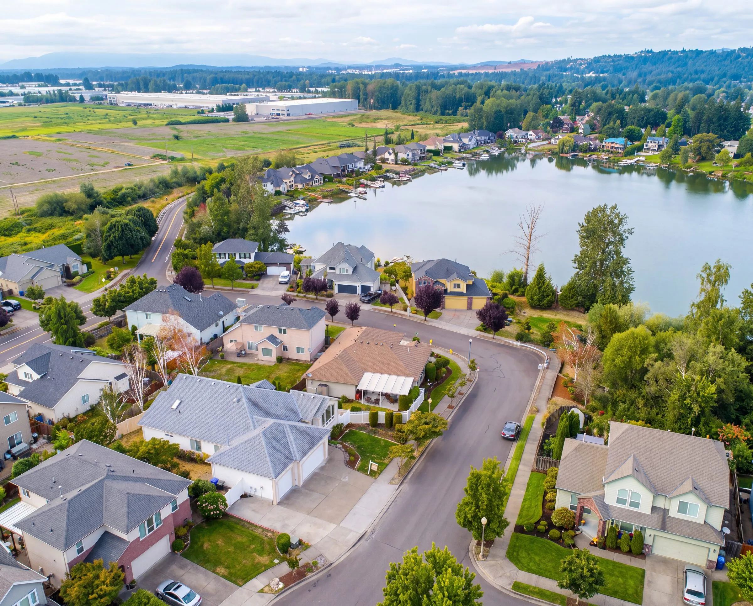 An aerial view of homes beside Fairview Lake in Fairview, Oregon
