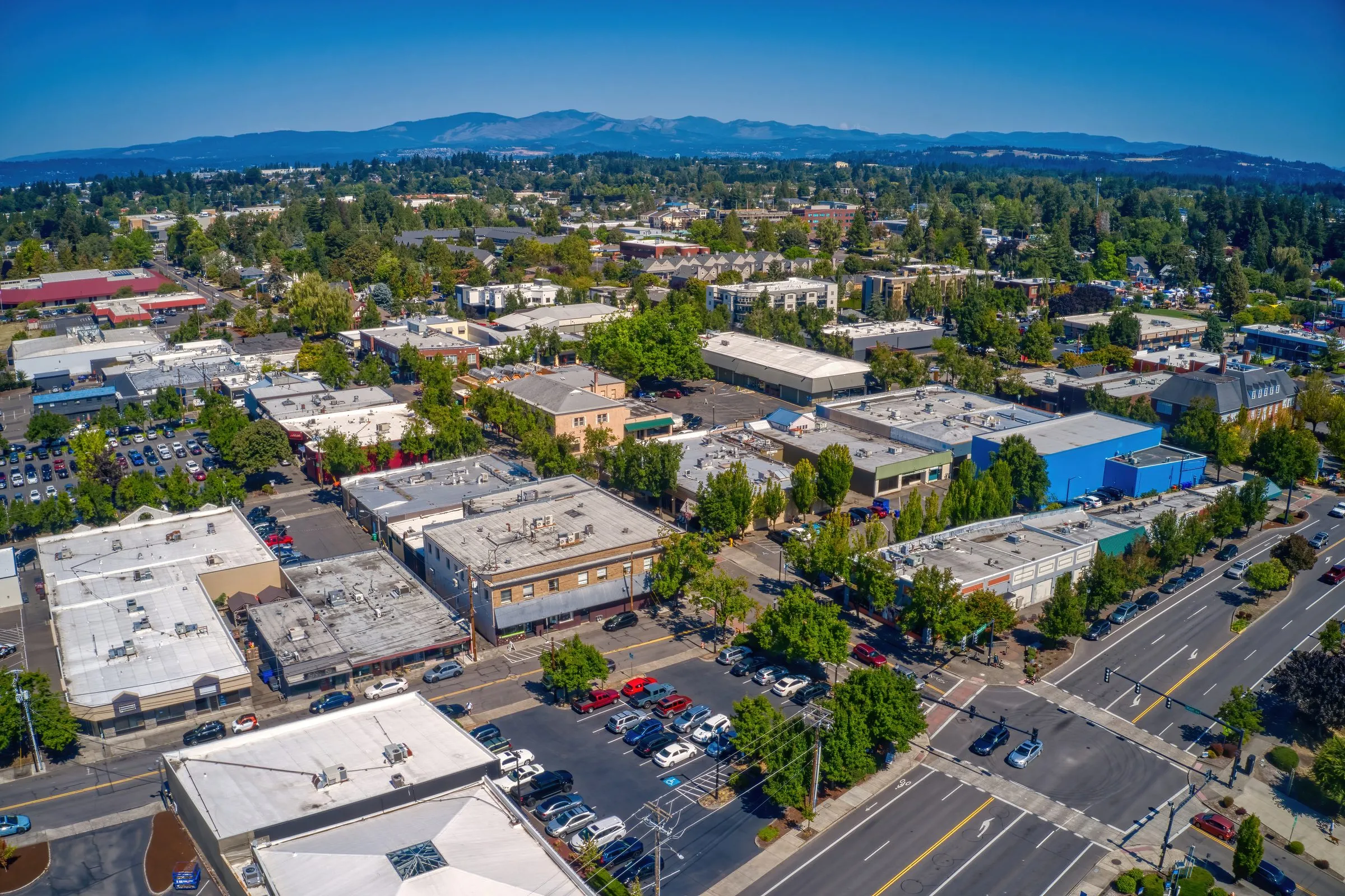 An aerial view of downtown Gresham, Oregon, with hills in the distance