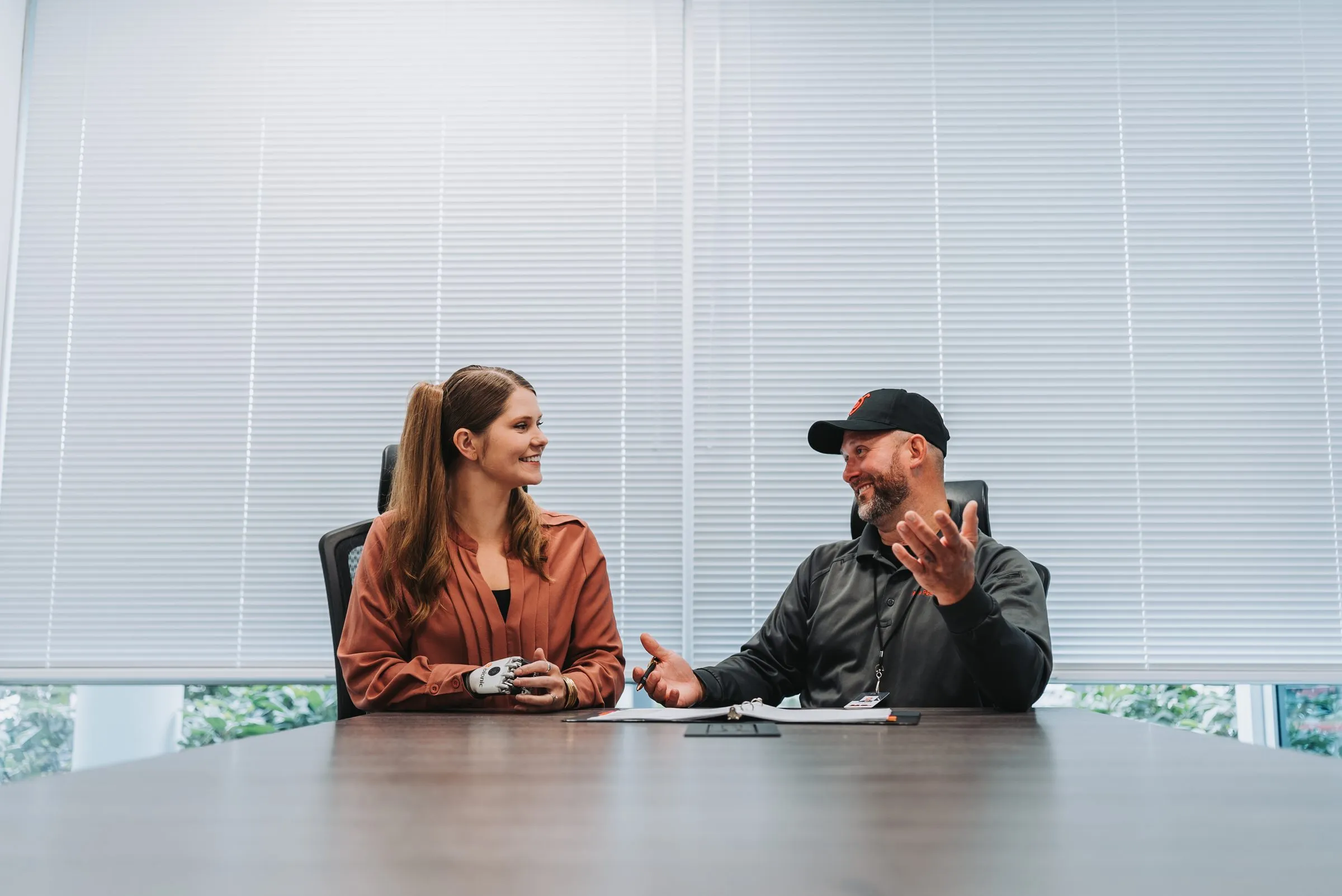An A&A account manager and a property manager talking across a conference table