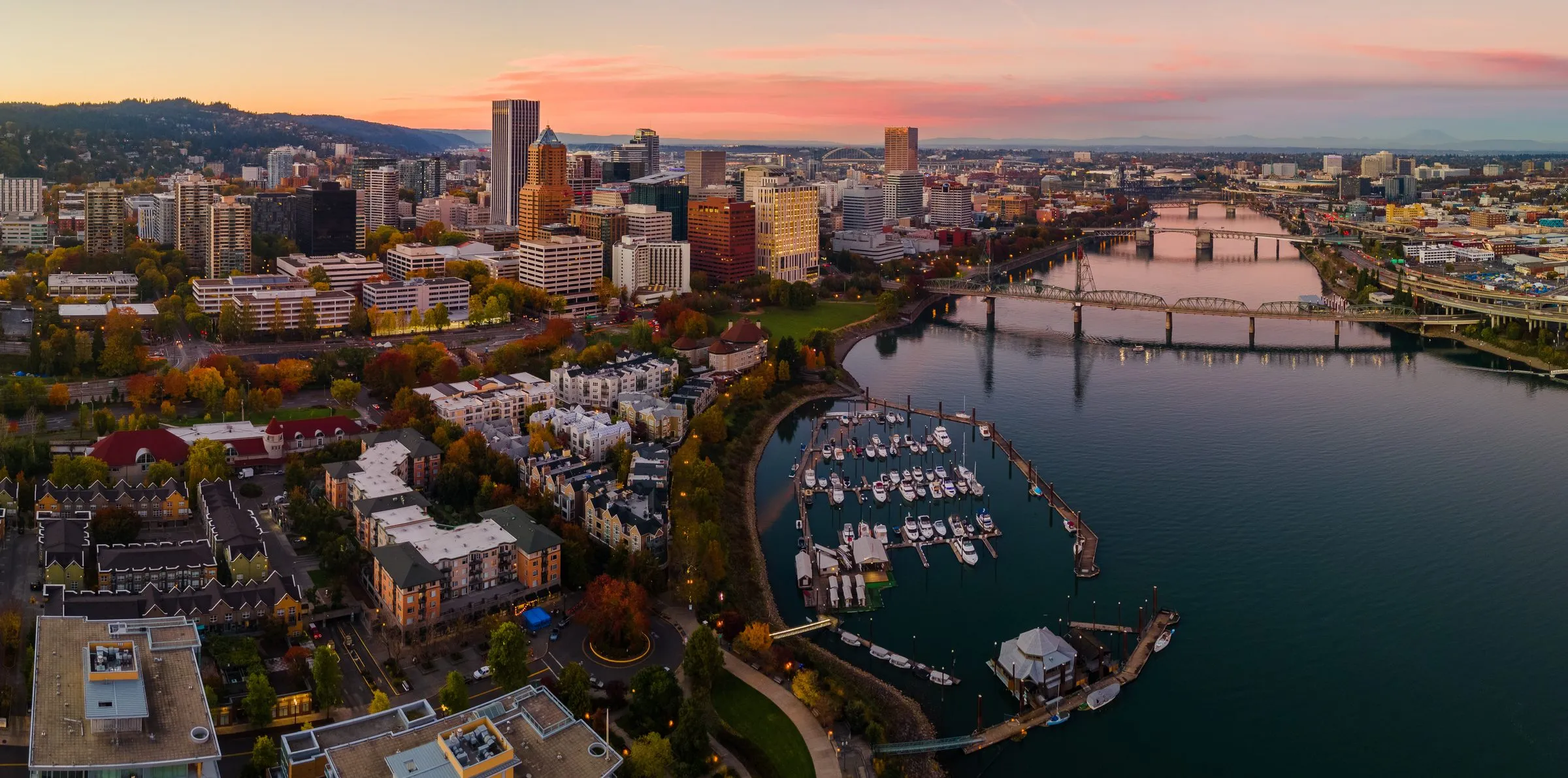 Downtown Portland and the Willamette River at sunset, with boats in the marina