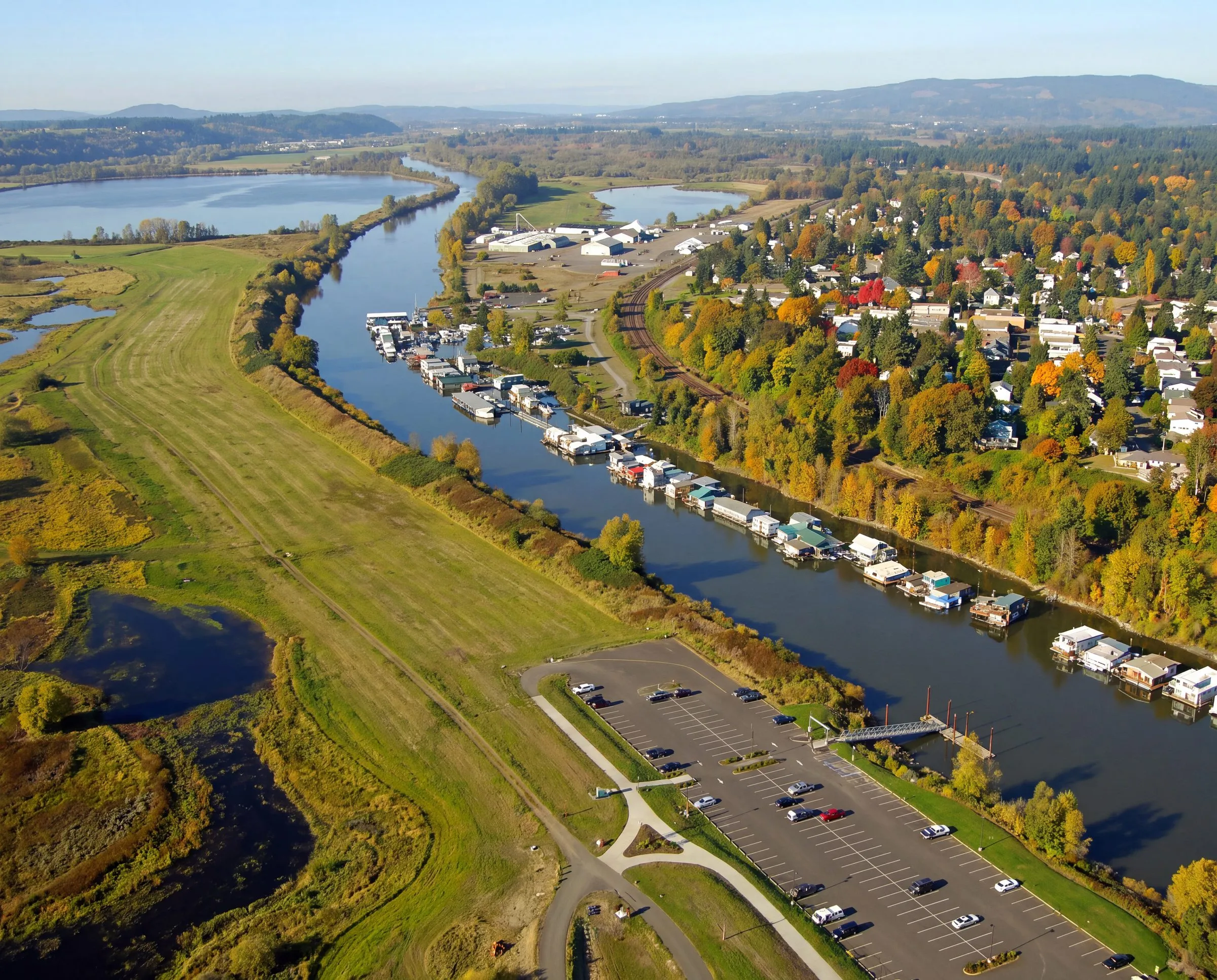 An aerial view of a river lined with houseboats near Ridgefield, Washington