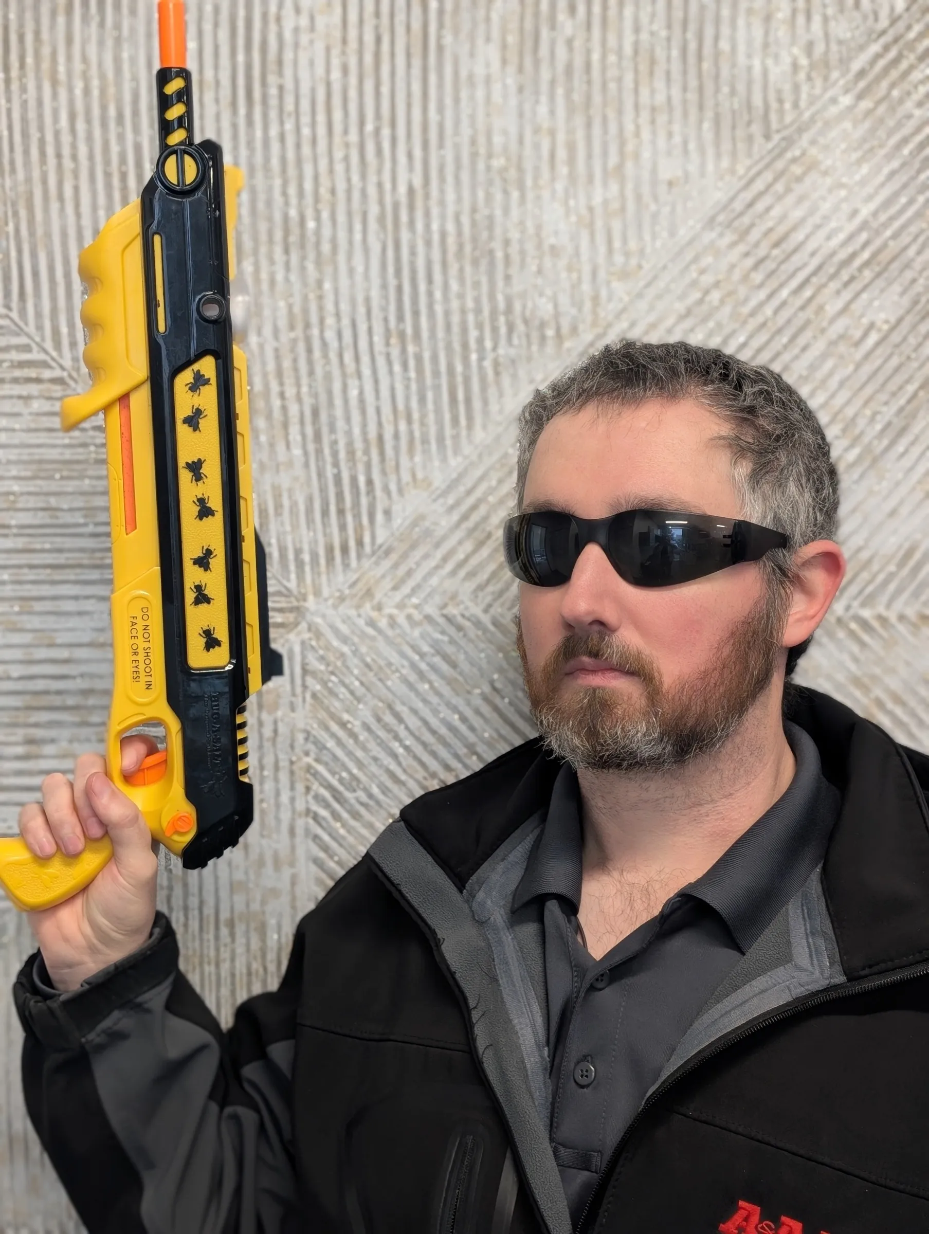 An A&A technician in sunglasses posing for a fun team portrait