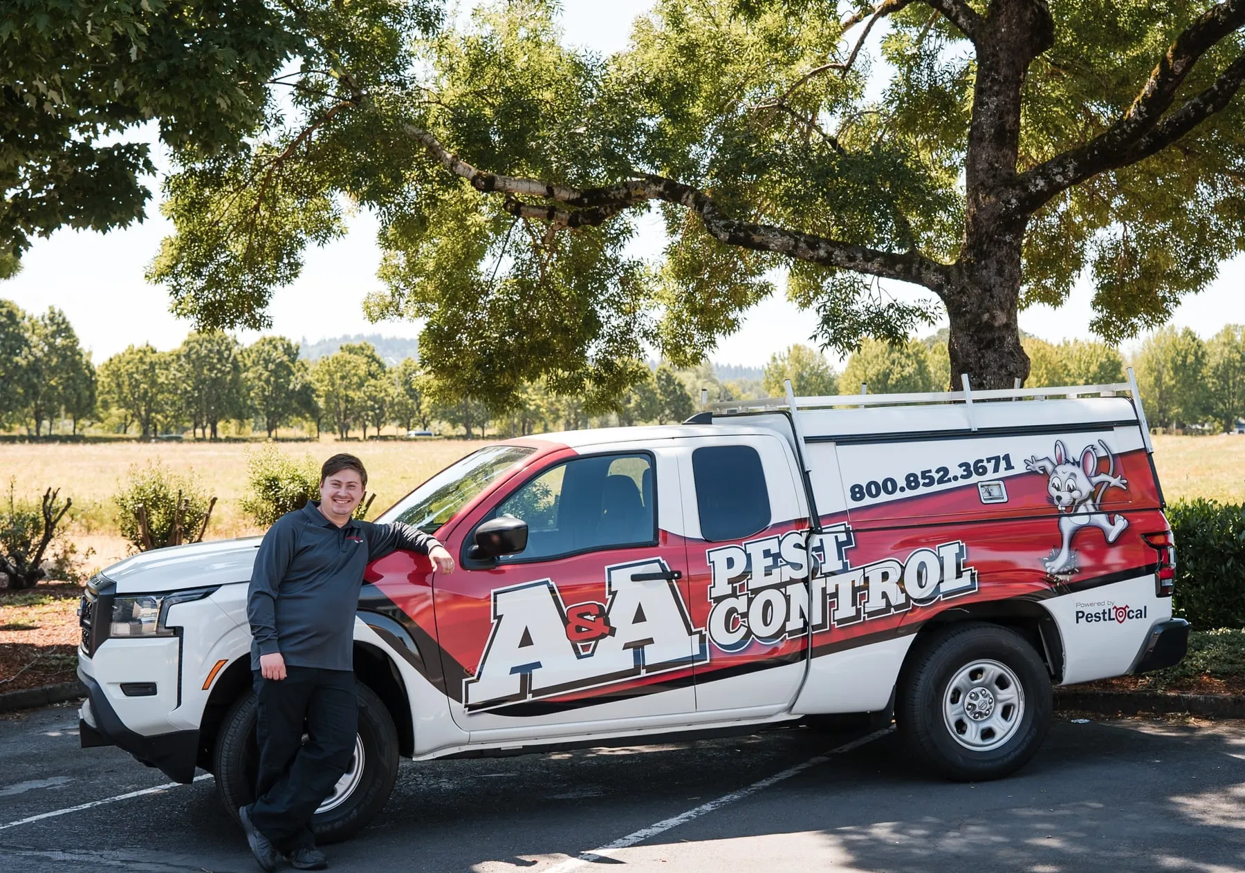 John N, one of A&A's Vancouver technicians, leaning on his A&A Pest Control truck